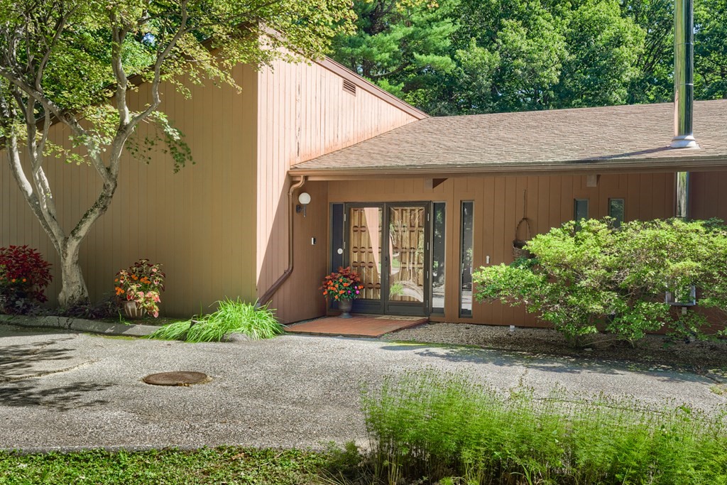 18 Old Lantern Circle Paxton, MA 01612 - Photo 5 of 41 a view of a house with a yard and plants