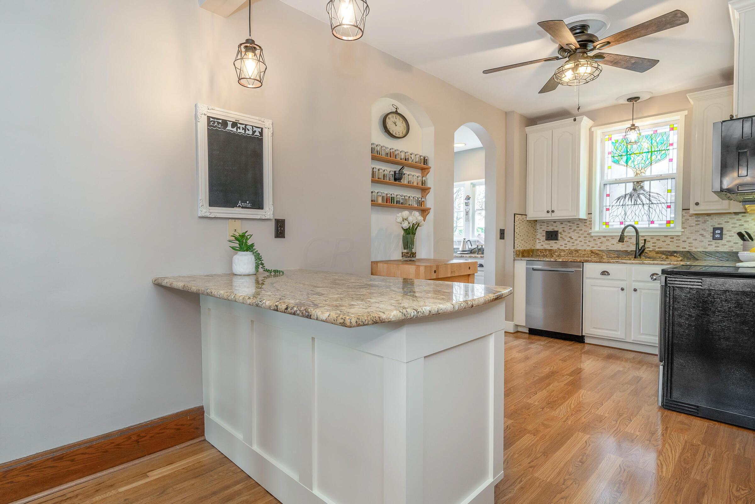132 Chatham Road Columbus, OH 43214 - Photo 12 of 41 This updated kitchen boasts granite counters and updated stainless steel appliances. Bar seating at this counter is ideal!