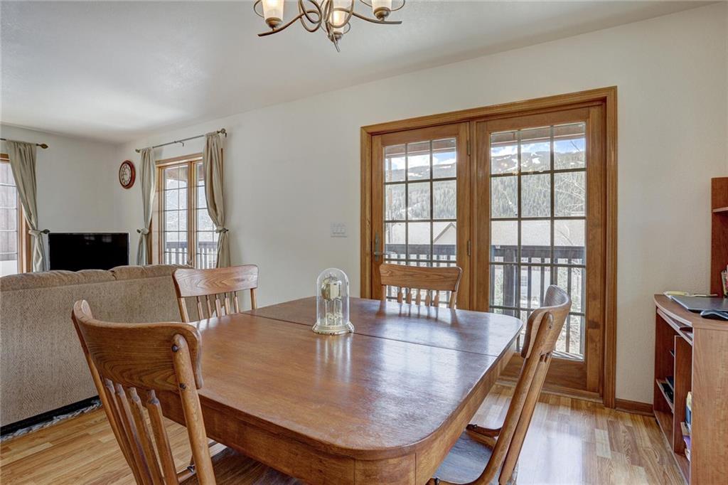 47 West Hansen Road Keystone, CO 80435 - Photo 13 of 35 a dining room with furniture window and wooden floor