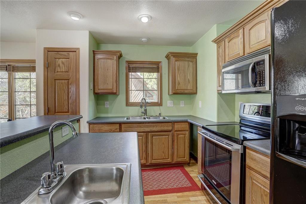 47 West Hansen Road Keystone, CO 80435 - Photo 17 of 35 a kitchen with stainless steel appliances a sink stove and cabinets