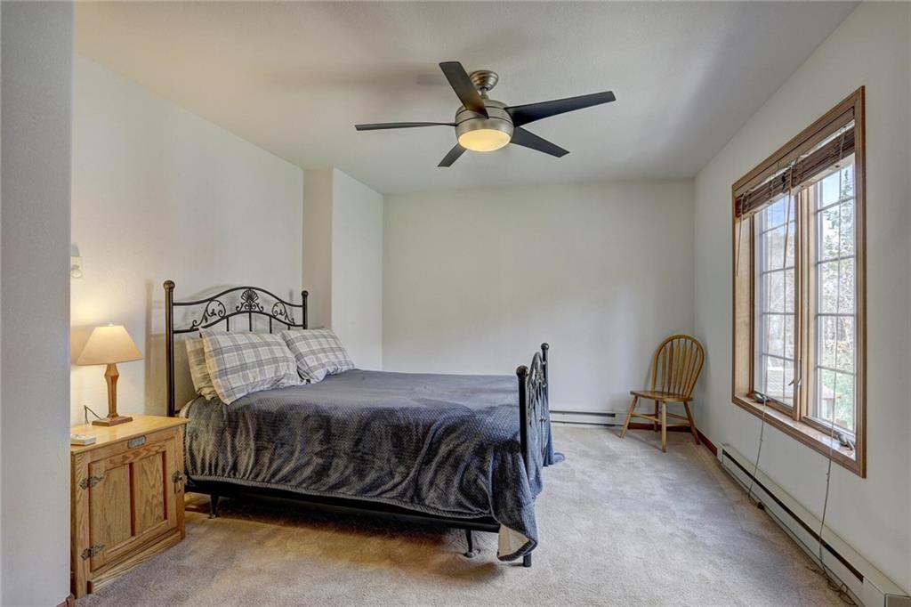 47 West Hansen Road Keystone, CO 80435 - Photo 19 of 35 a bedroom with a bed chair and window