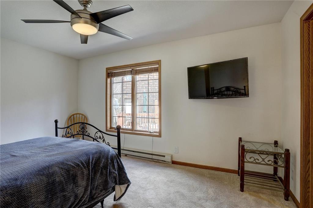 47 West Hansen Road Keystone, CO 80435 - Photo 20 of 35 a bedroom with a bed and a flat screen tv