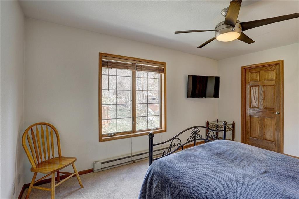 47 West Hansen Road Keystone, CO 80435 - Photo 22 of 35 a bedroom with a bed chair and two windows
