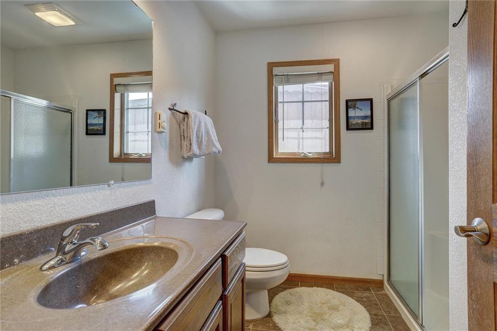 47 West Hansen Road Keystone, CO 80435 - Photo 24 of 35 a bathroom with a toilet sink and mirror