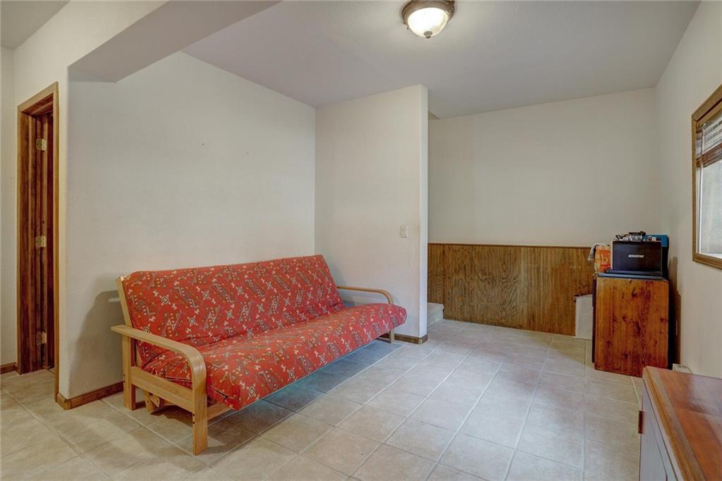 47 West Hansen Road Keystone, CO 80435 - Photo 27 of 35 a blue bed sitting in a room next to a lamp