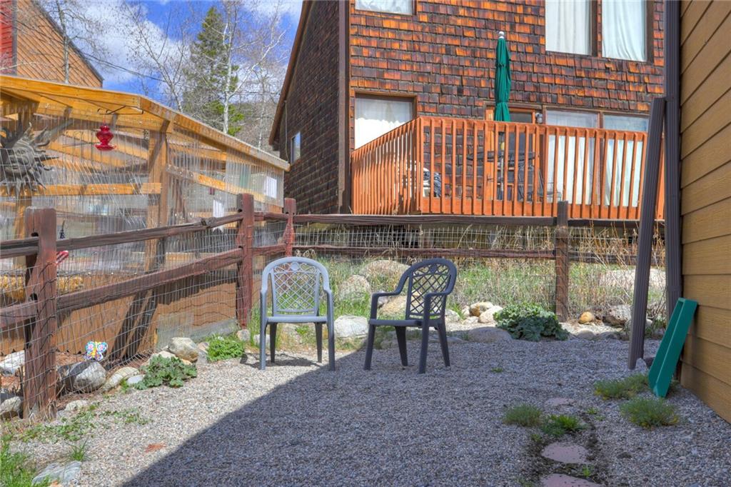 47 West Hansen Road Keystone, CO 80435 - Photo 32 of 35 a view of a chairs and table in the backyard