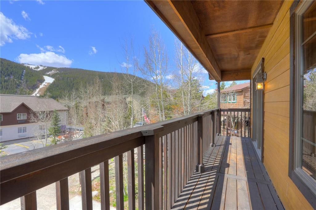 47 West Hansen Road Keystone, CO 80435 - Photo 5 of 35 a view of a balcony with wooden floor and fence