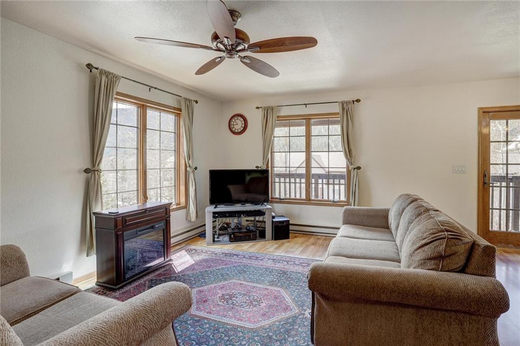 47 West Hansen Road Keystone, CO 80435 - Photo 8 of 35 a living room with furniture a flat screen tv and a window