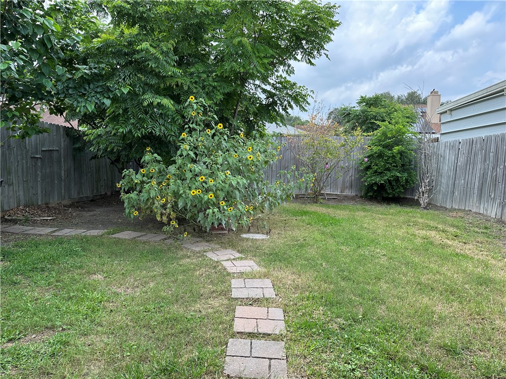7322 Pepper Ridge Road Corpus Christi, TX 78413 - Photo 11 of 11 a view of a yard with plants and large trees