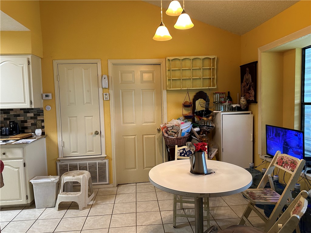 7322 Pepper Ridge Road Corpus Christi, TX 78413 - Photo 2 of 11 a dining room with furniture and wooden floor