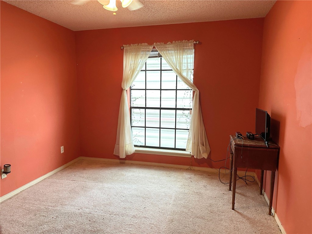 7322 Pepper Ridge Road Corpus Christi, TX 78413 - Photo 8 of 11 an empty room with a window