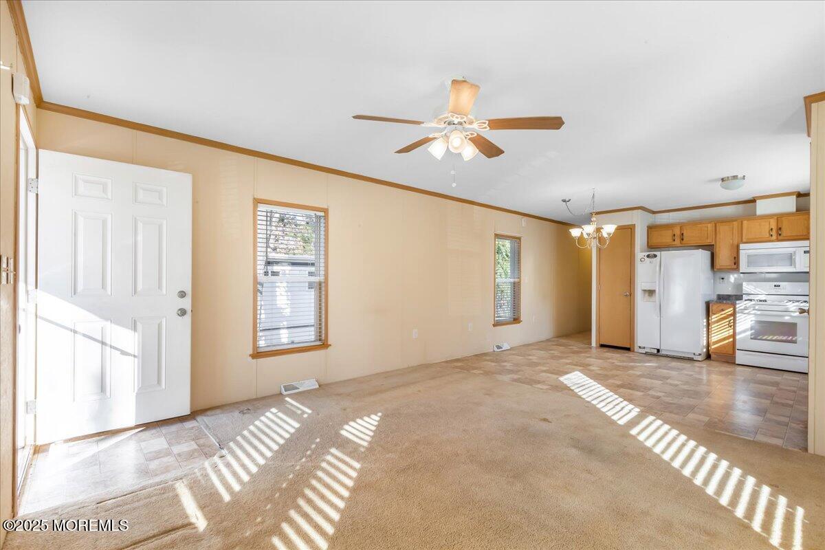 71 Roberts Road Toms River, NJ 08755 - Photo 6 of 14 a view of livingroom with hardwood floor and a ceiling fan