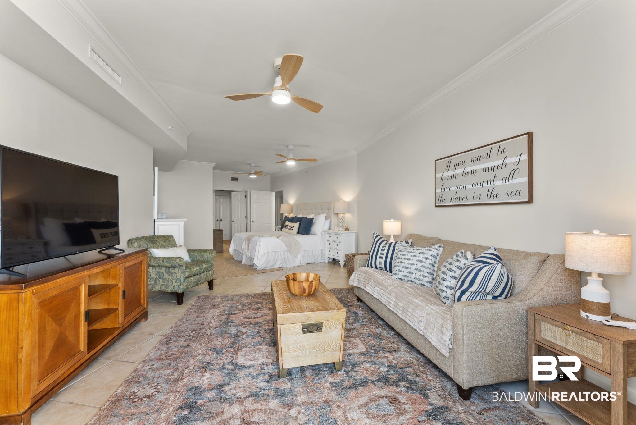 27580 Canal Road, Unit 1233 Orange Beach, AL 36561 - Photo 25 of 79 Living area with ornamental molding, light tile patterned floors, and ceiling fan