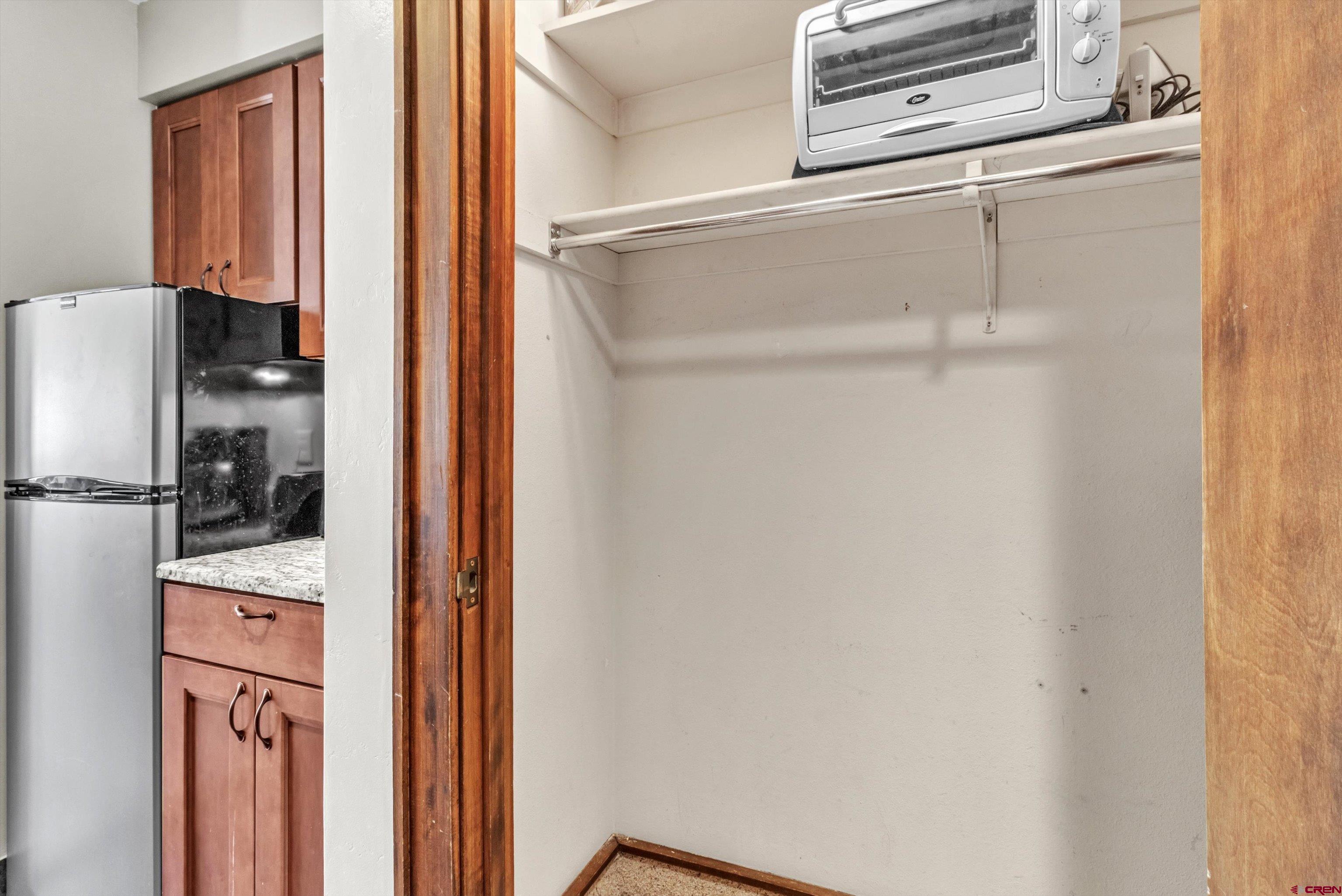 314 Tamarron Drive, Unit 511 Durango, CO 81301 - Photo 16 of 36 a kitchen with a refrigerator and a stove