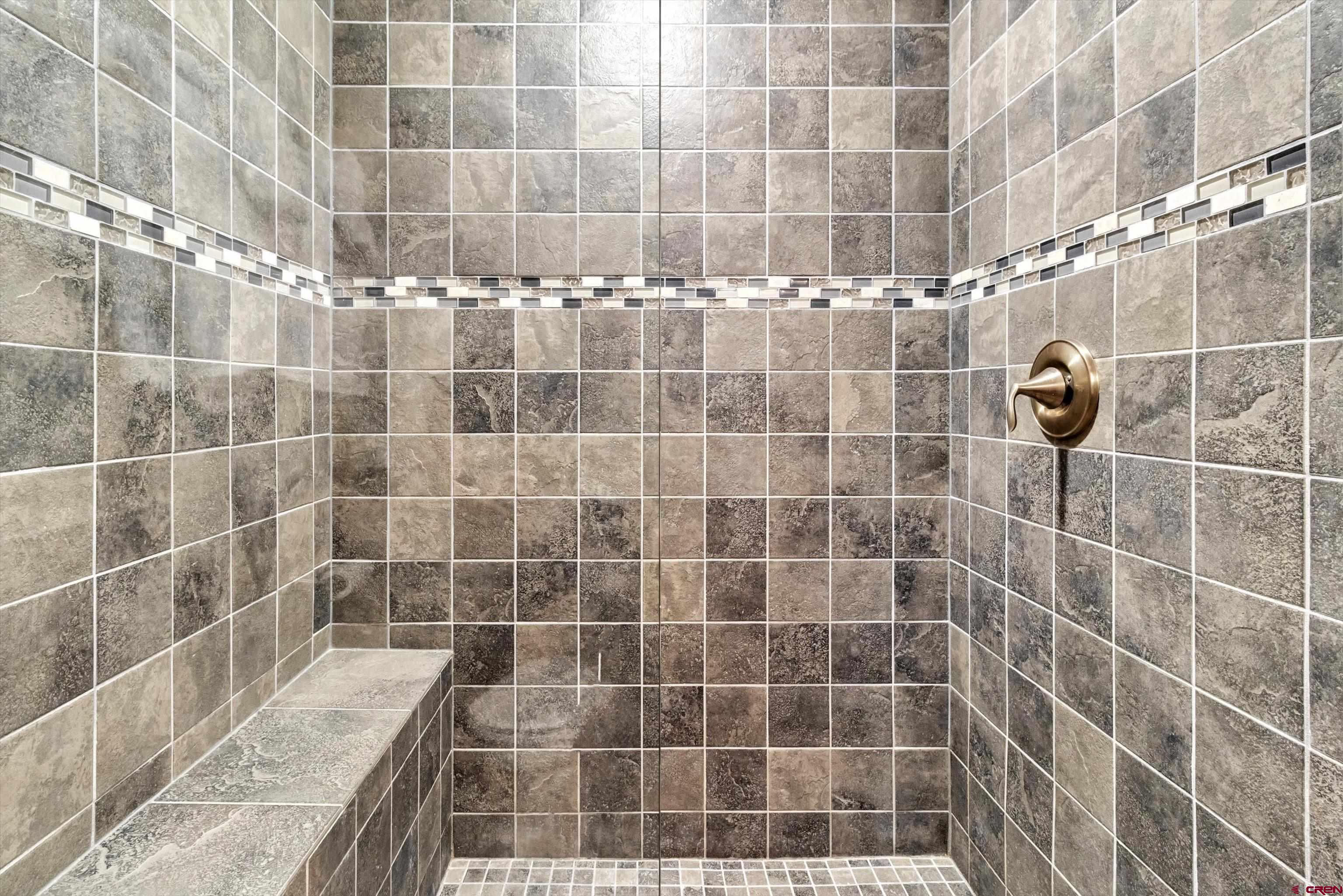 314 Tamarron Drive, Unit 511 Durango, CO 81301 - Photo 20 of 36 a bathroom with a shower