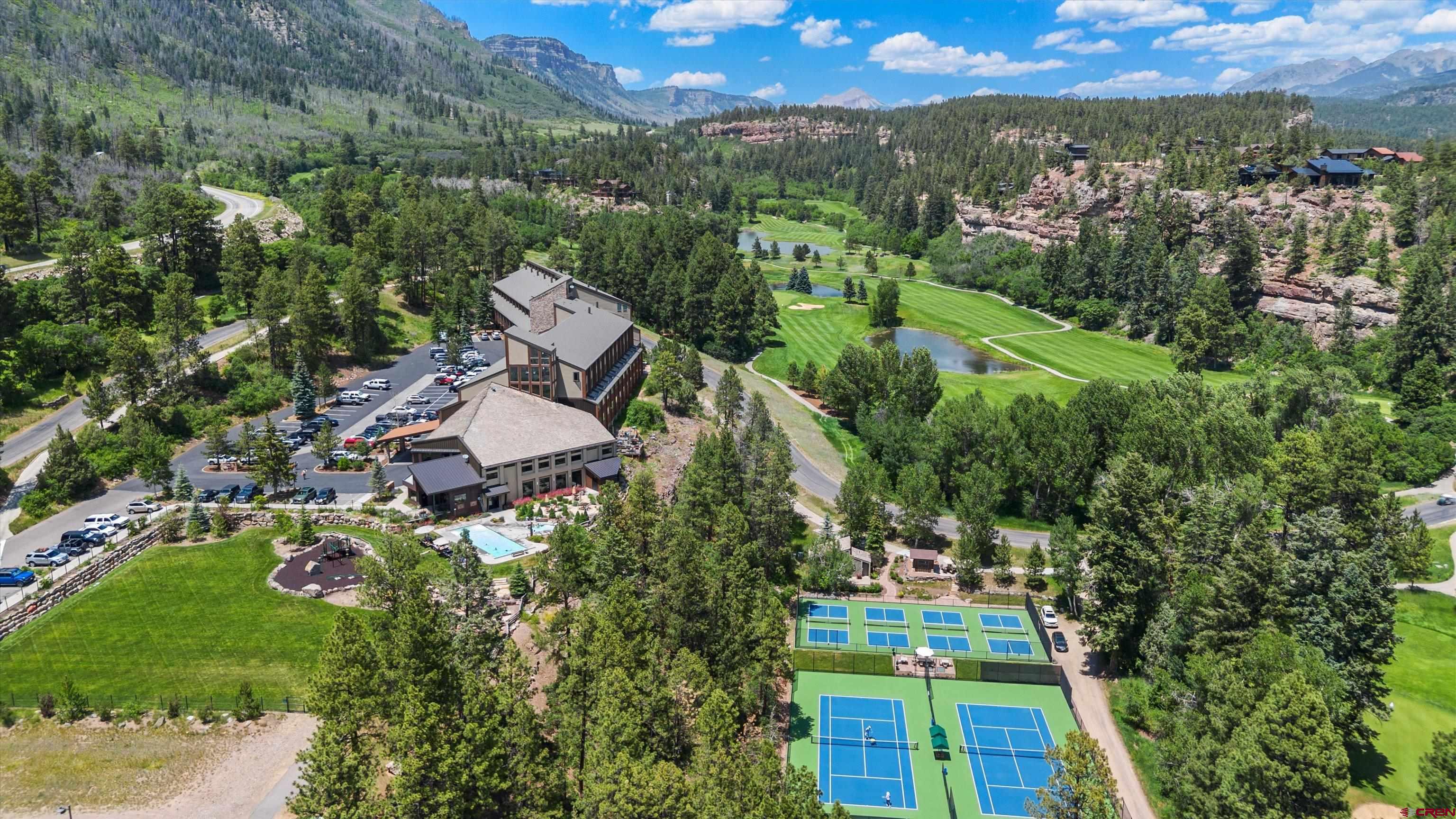 314 Tamarron Drive, Unit 511 Durango, CO 81301 - Photo 24 of 36 an aerial view of residential houses with outdoor space and trees