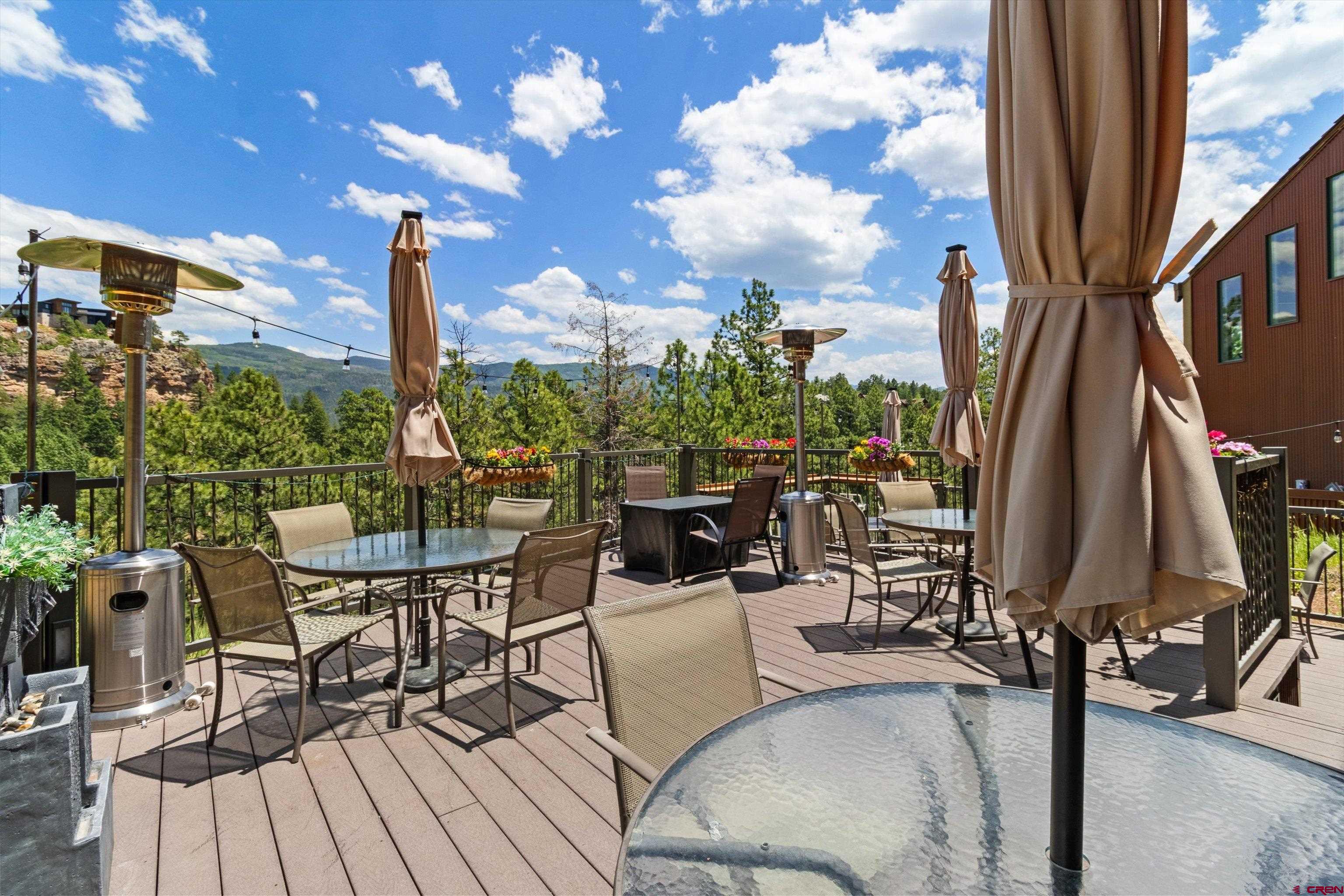 314 Tamarron Drive, Unit 511 Durango, CO 81301 - Photo 35 of 36 a view of a balcony with chairs and wooden floor
