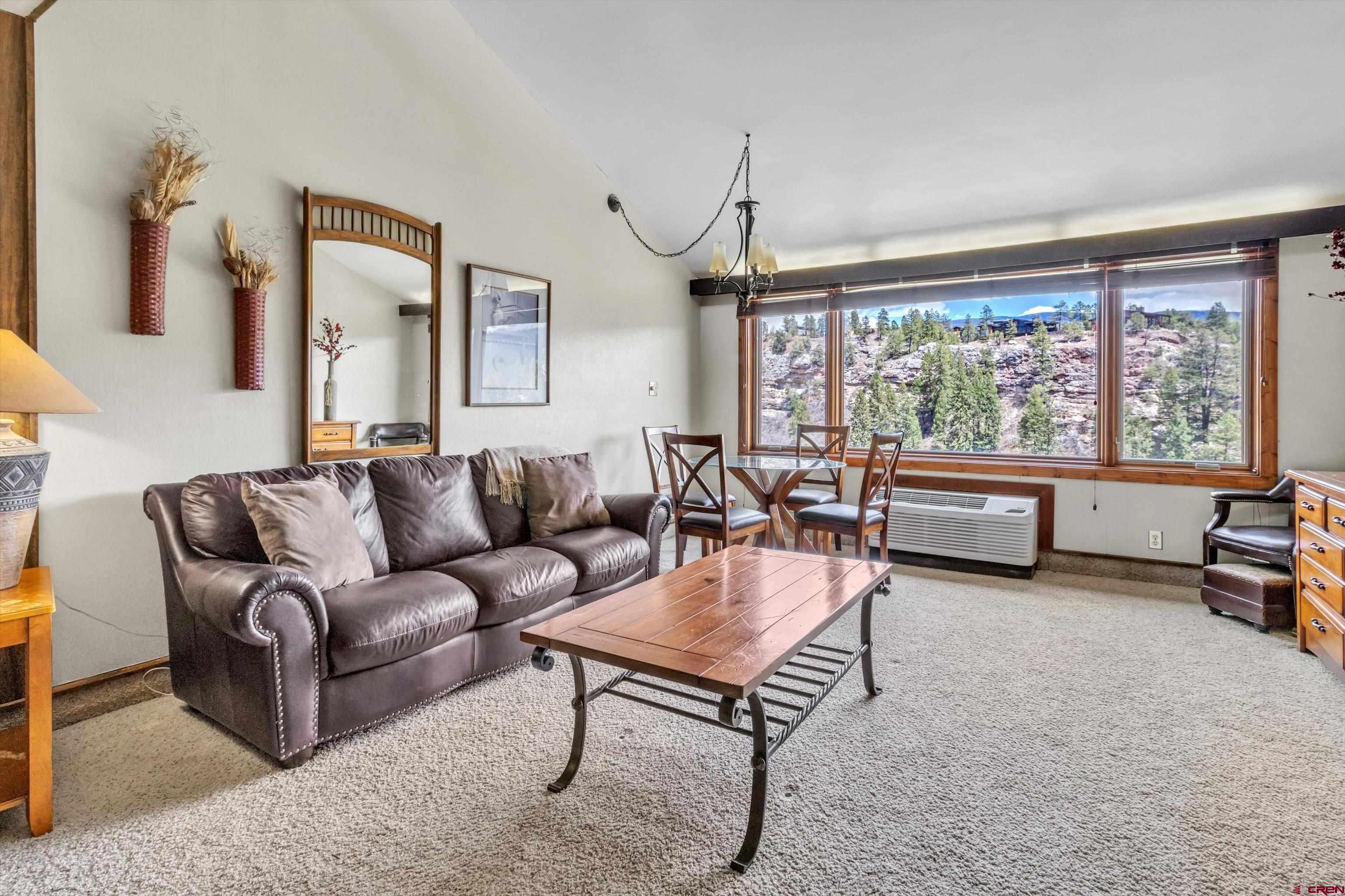 314 Tamarron Drive, Unit 511 Durango, CO 81301 - Photo 8 of 36 a living room with furniture and a large window