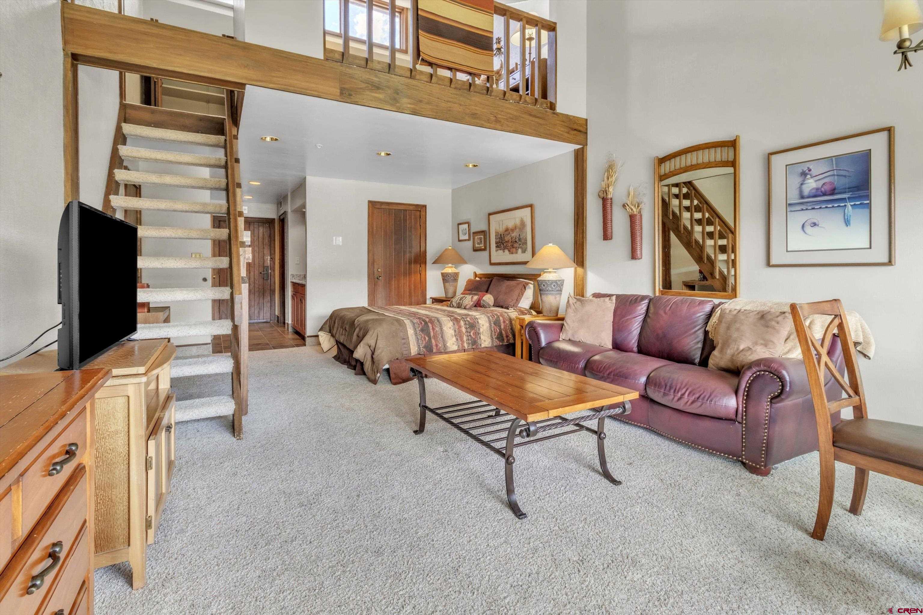 314 Tamarron Drive, Unit 511 Durango, CO 81301 - Photo 10 of 36 a living room with furniture and a flat screen tv