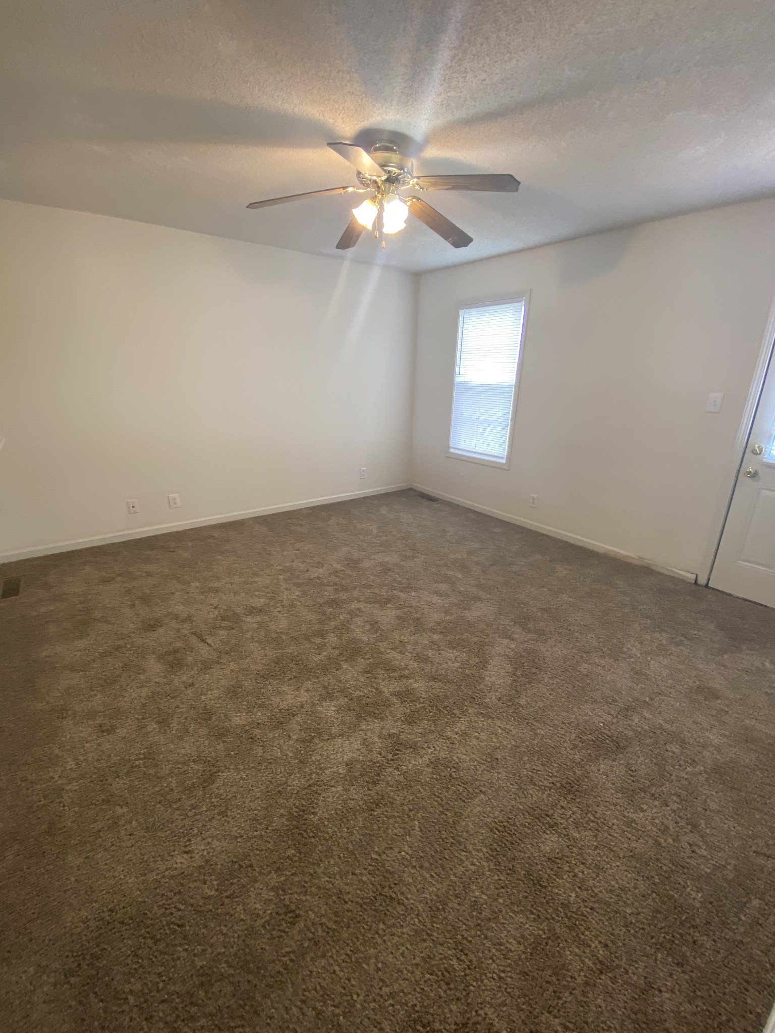 233 Tree Line Drive Oak Grove, KY 42262 - Photo 11 of 12 an empty room with windows and fan