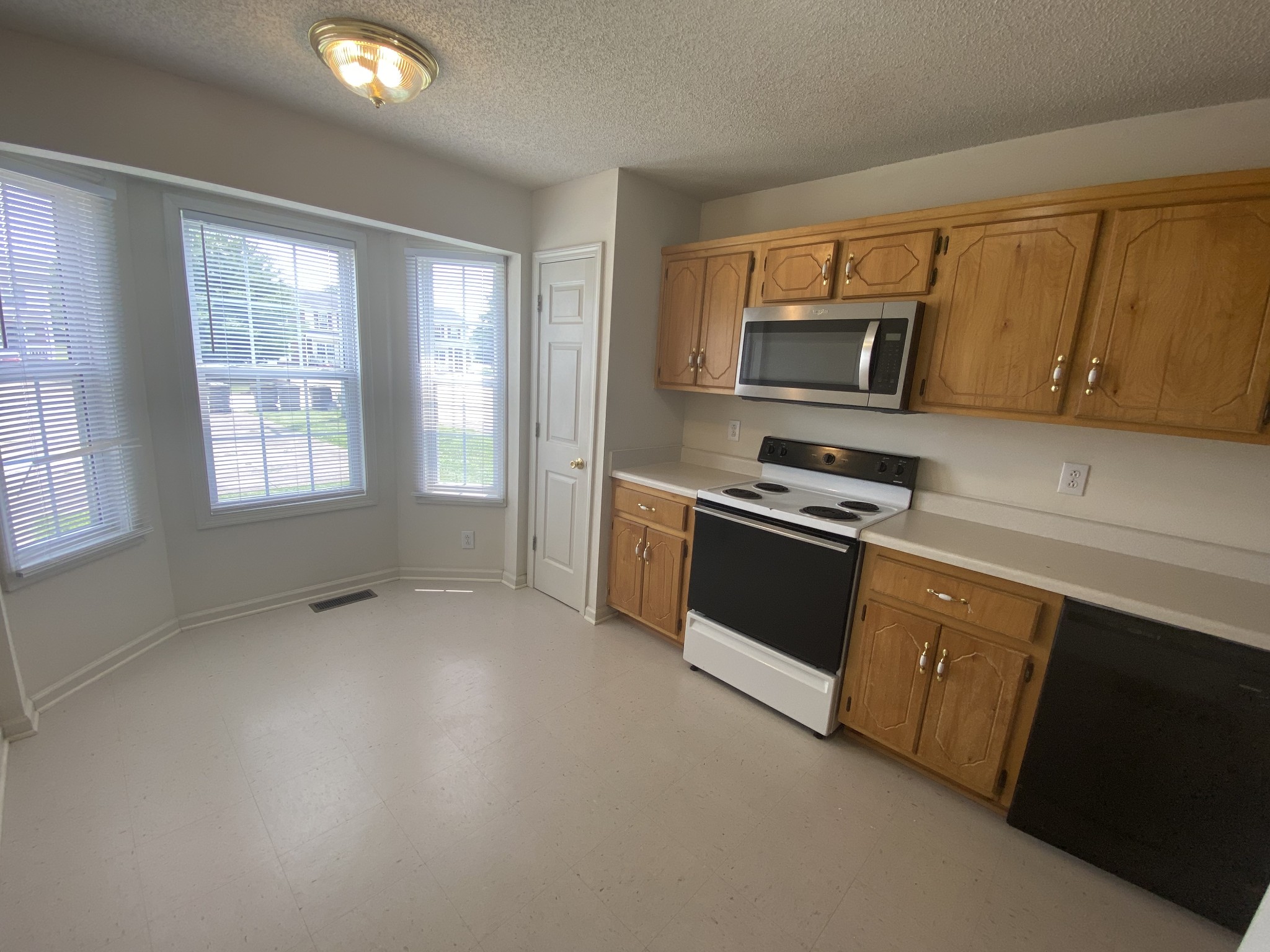 233 Tree Line Drive Oak Grove, KY 42262 - Photo 3 of 12 a kitchen with stainless steel appliances a stove sink and microwave