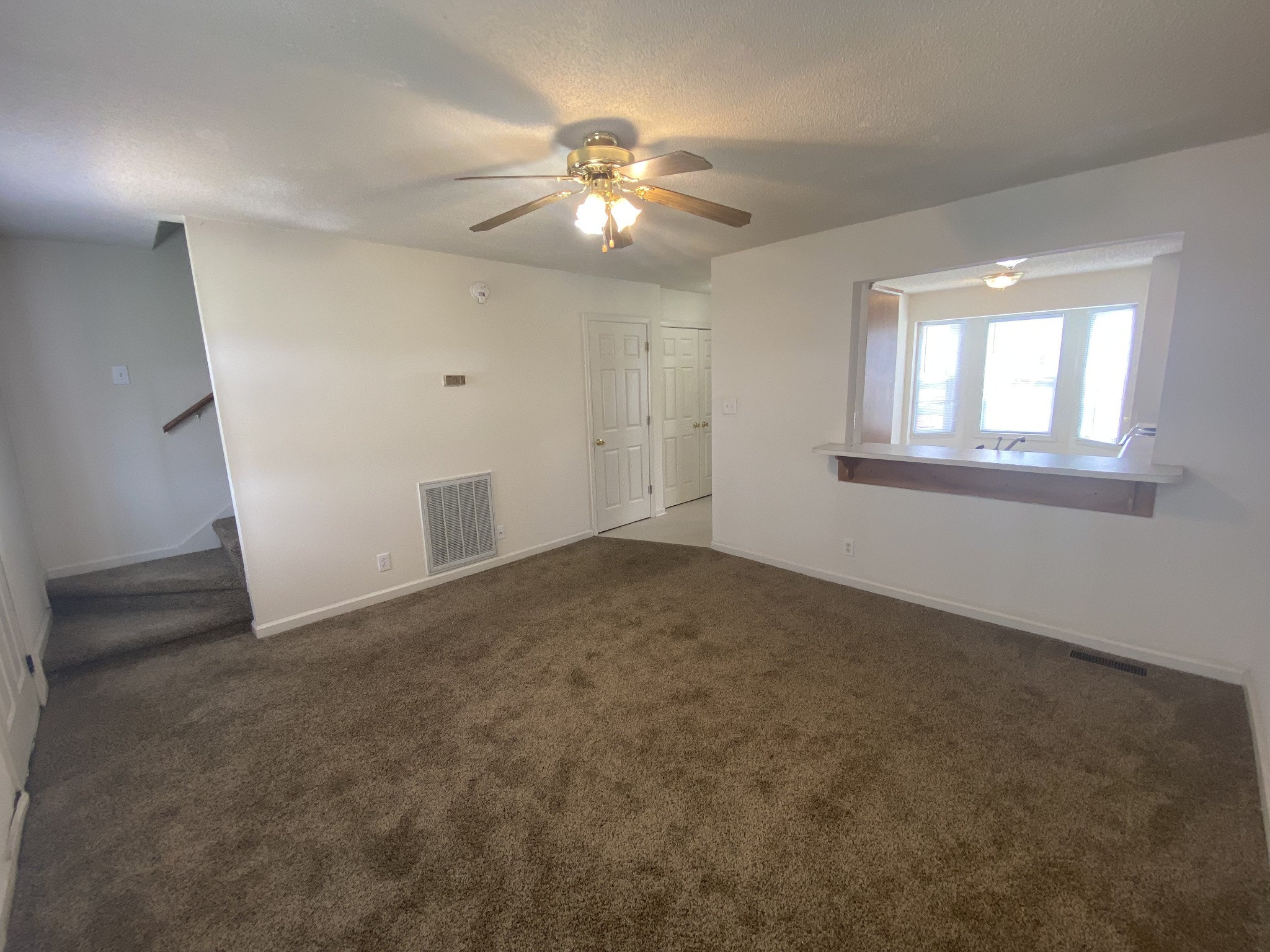 233 Tree Line Drive Oak Grove, KY 42262 - Photo 4 of 12 a view of a livingroom with a ceiling fan and window