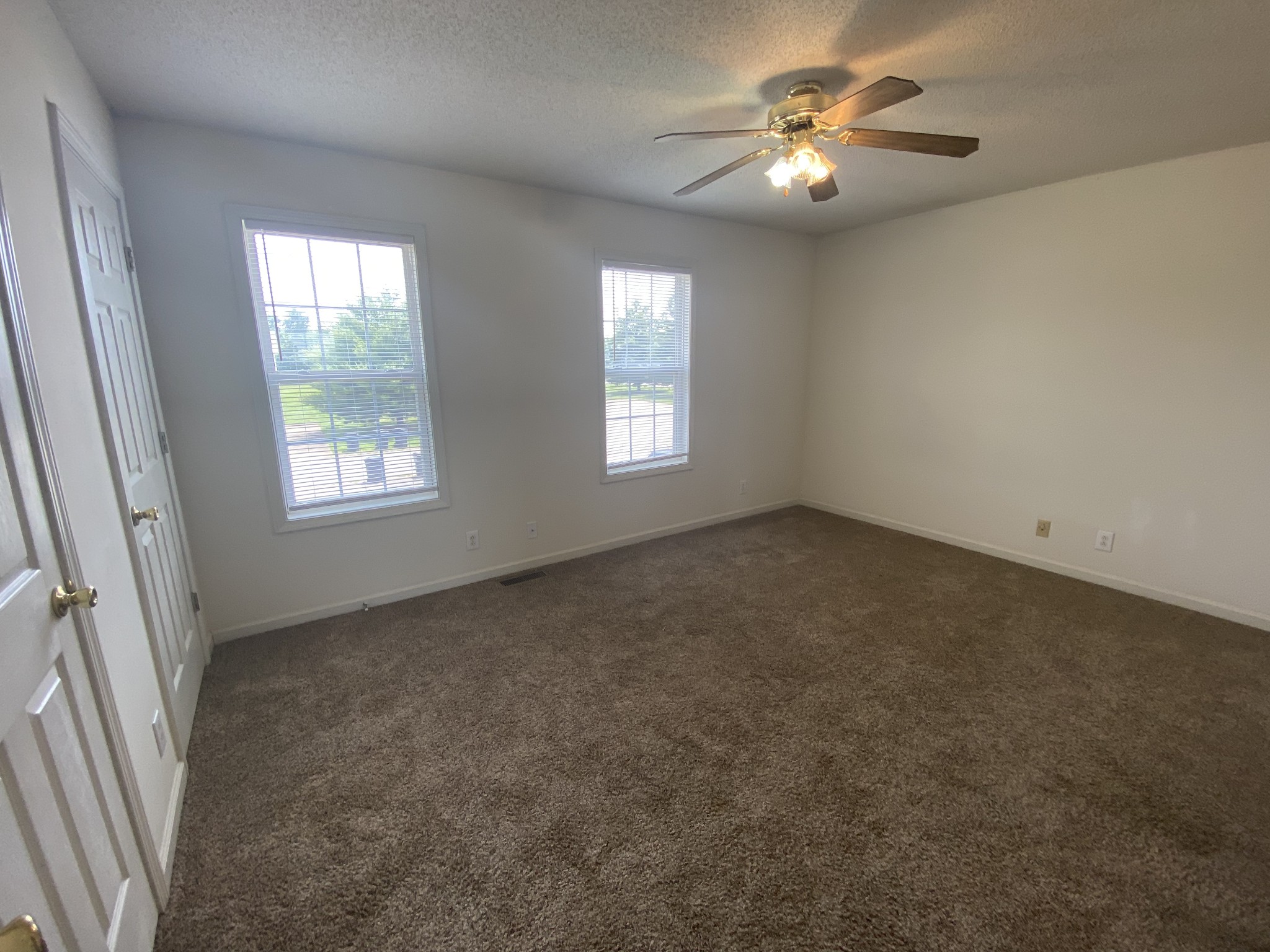 233 Tree Line Drive Oak Grove, KY 42262 - Photo 8 of 12 an empty room with windows and fan