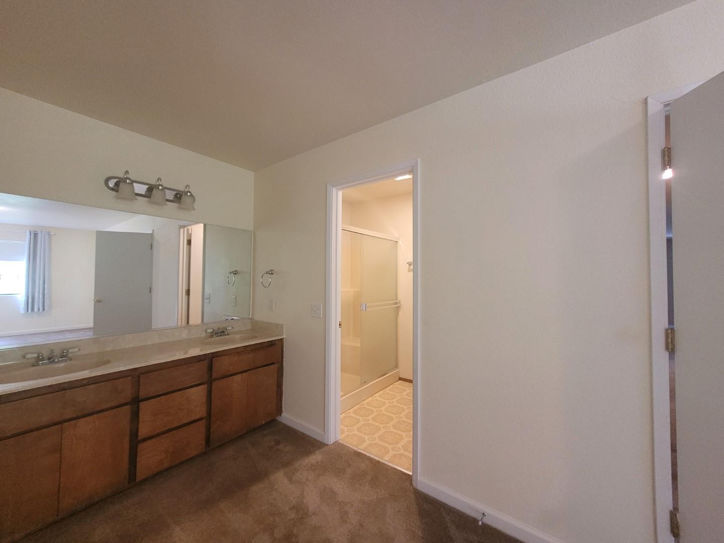 346 Gracie Road Nevada City, CA 95959 - Photo 41 of 66 a bathroom with a double vanity sink and mirror