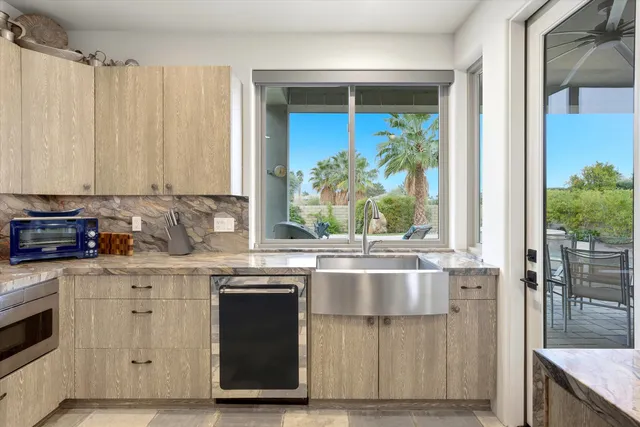 a view of living room with granite countertop furniture and fireplace