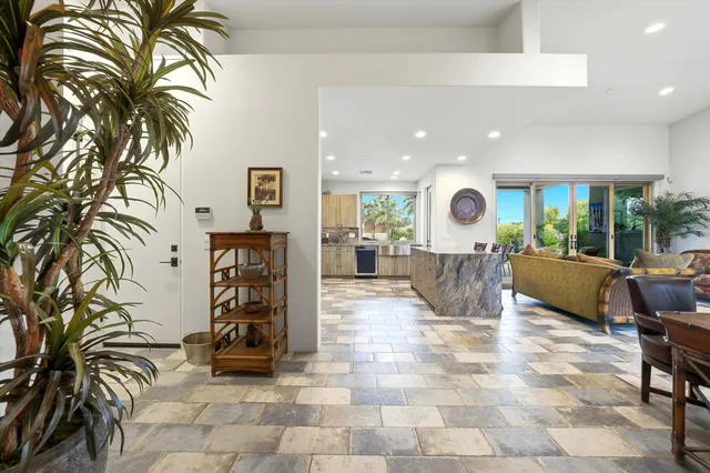 a view of a house with pool porch and sitting area