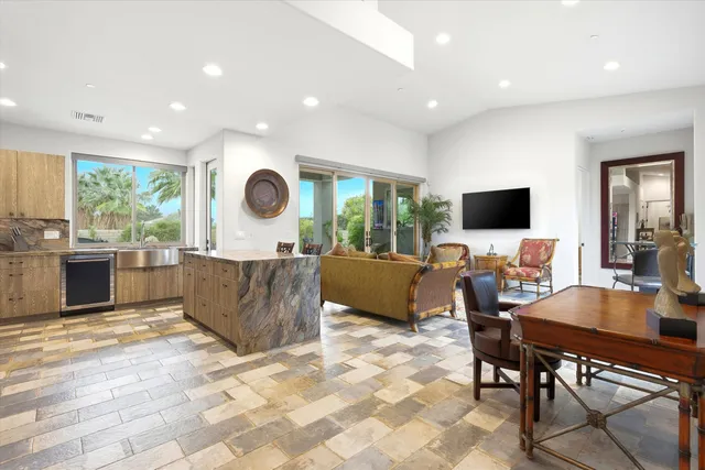 a view of a swimming pool with a lounge chair