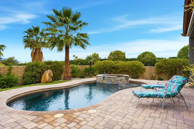 a view of an chairs and table in patio