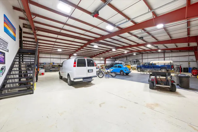 a view of parking garage with cars