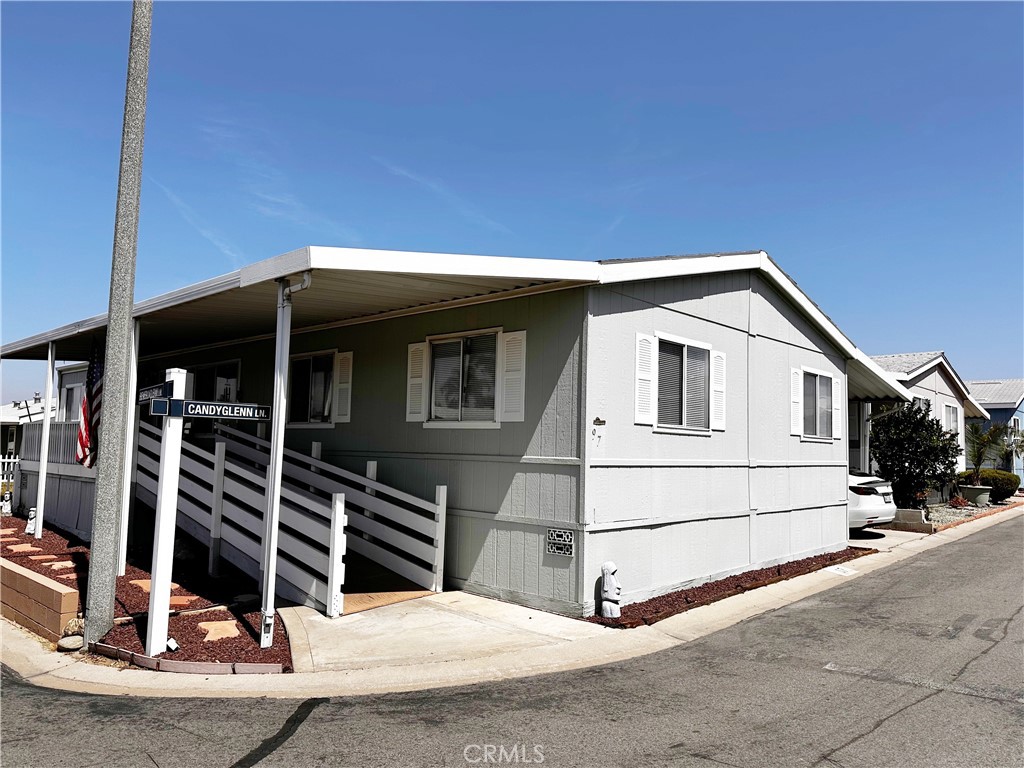 2140 Mentone Boulevard, Unit 97 Mentone, CA 92359 - Photo 1 of 29 a view of house with garage