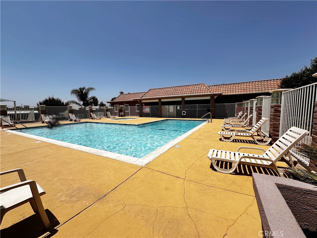 2140 Mentone Boulevard, Unit 97 Mentone, CA 92359 - Photo 23 of 29 a view of swimming pool with seating area