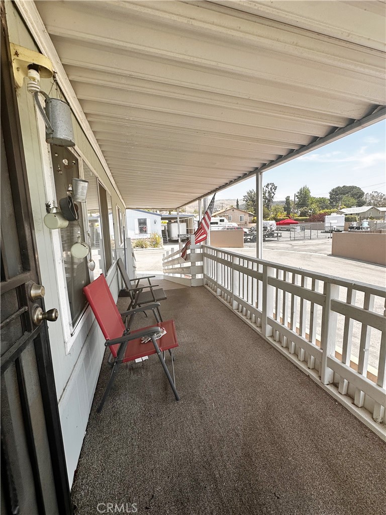 2140 Mentone Boulevard, Unit 97 Mentone, CA 92359 - Photo 5 of 29 a view of a porch with furniture