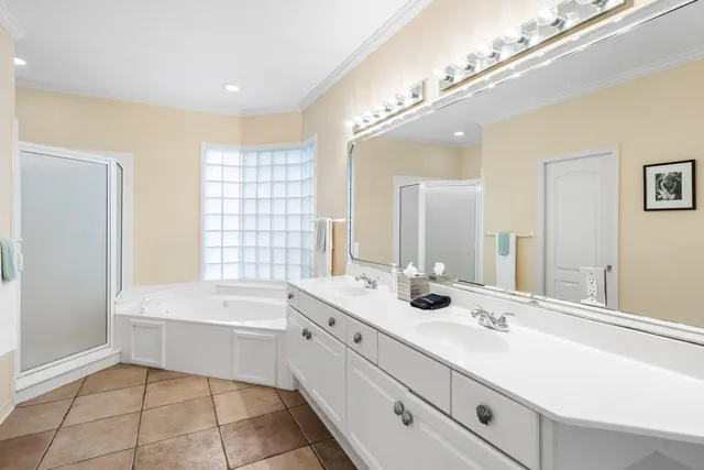 a bathroom with a bathtub a sink and a mirror