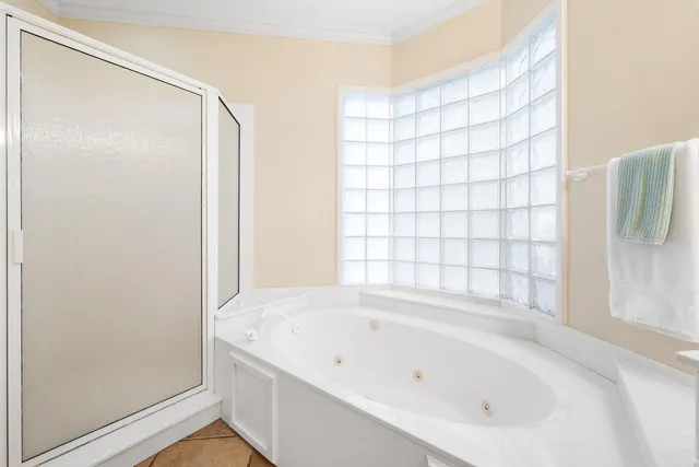 a bathroom with a bathtub and shower