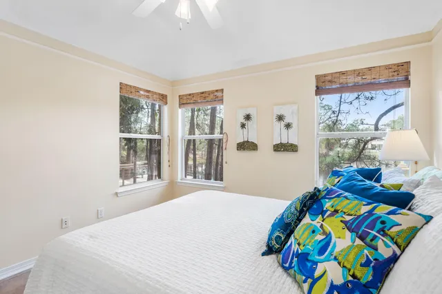 a bedroom with bed and window