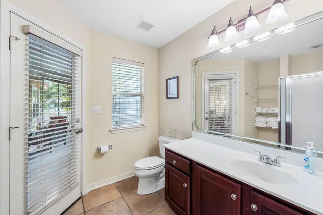 a bathroom with a mirror and a shower