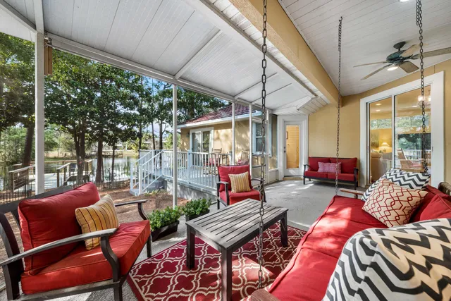a view of a house with backyard porch and sitting area