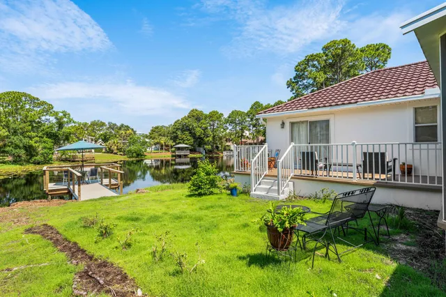 a view of a chairs and table on wooden floor