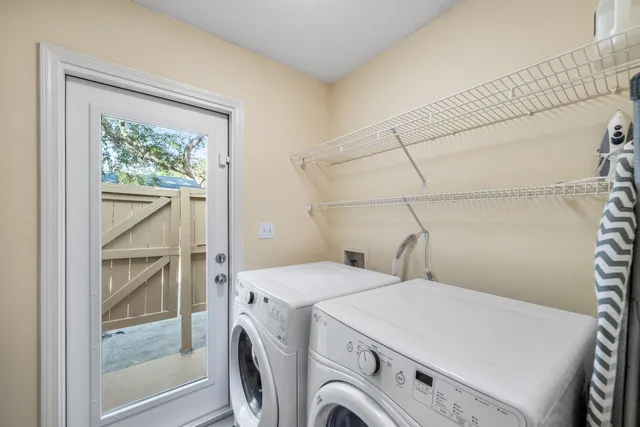 a view of a street with a houses in the background