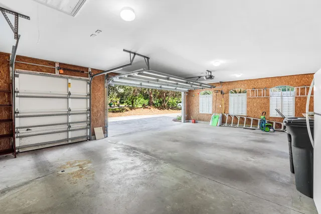 a view of a backyard with a large tree