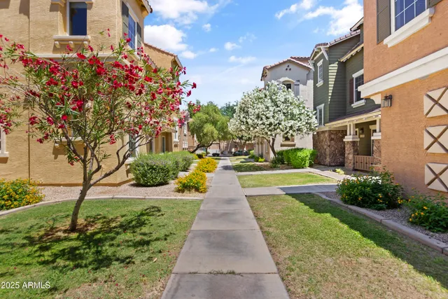 a view of flower garden in front of a building