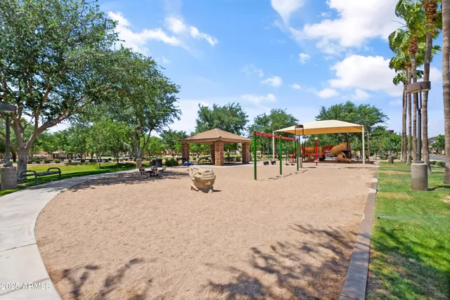 a view of outdoor space with garden and lots of trees