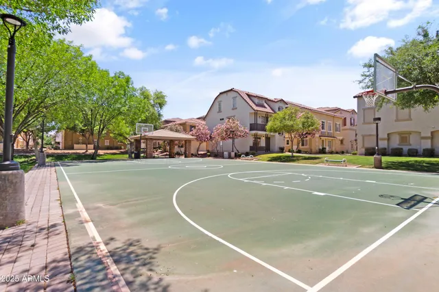 a living room with patio furniture and a yard