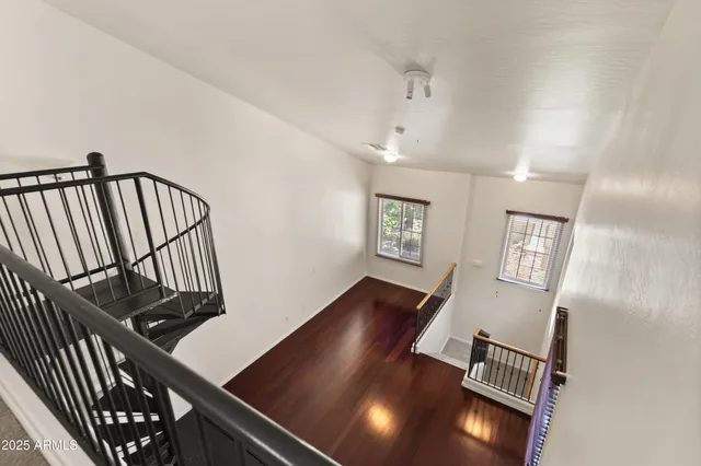 a view of an entryway and wooden floor