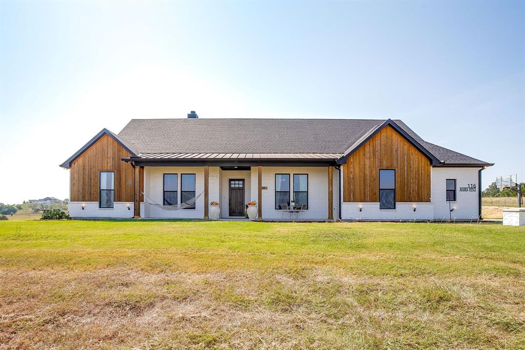 116 Aviara Ridge Road Poolville, TX 76487 - Photo 37 of 38 a view of a house with swimming pool and a yard