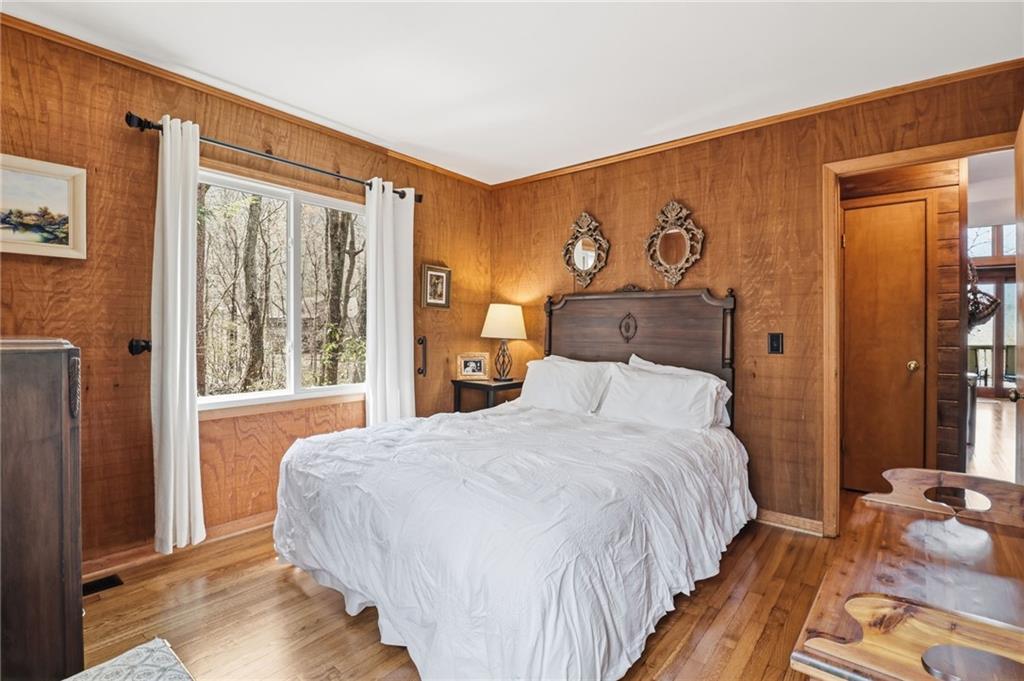 115 Chestnut Oak Point Big Canoe, GA 30143 - Photo 14 of 56 a bedroom with a bed and a window